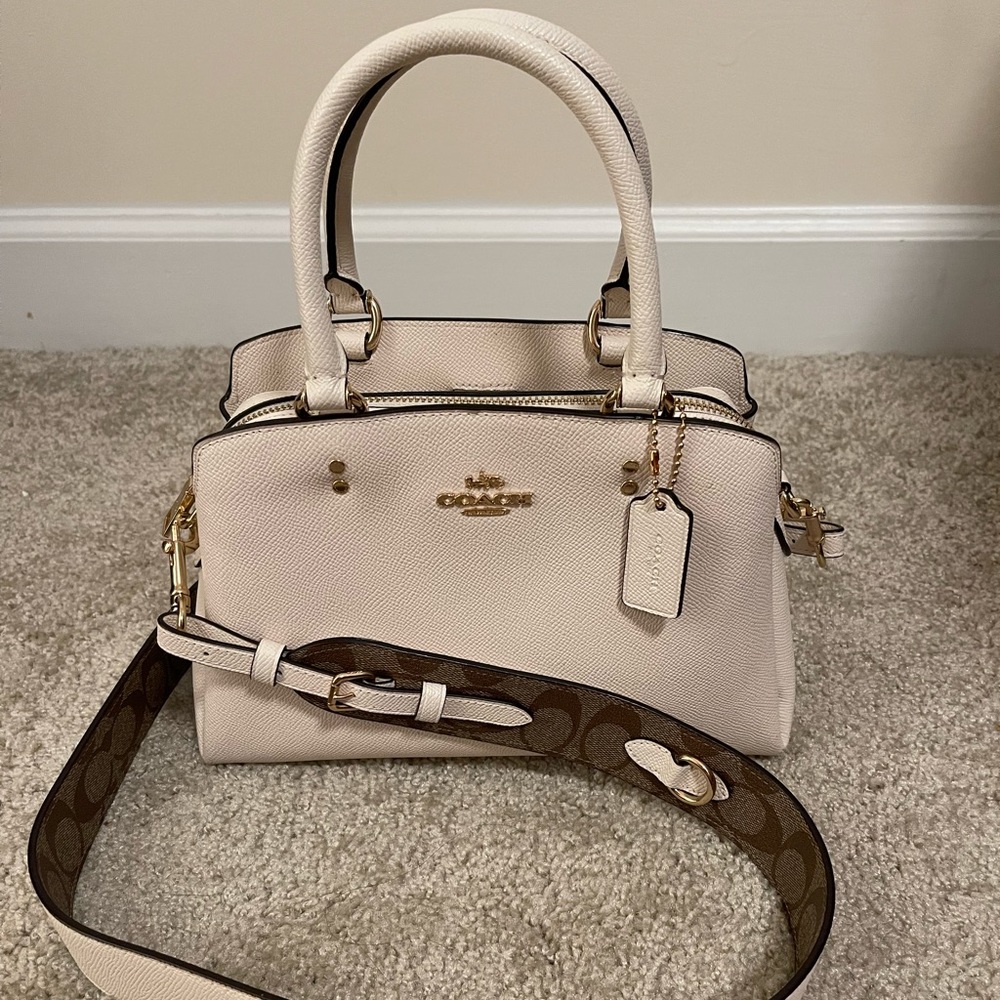 Coach Mini Lillie Carryall with signature canvas detail.